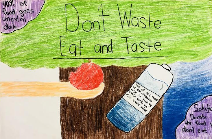Poster made by a student that says "Don't Waste, Eat and Taste" and shows a hand holding an apple.