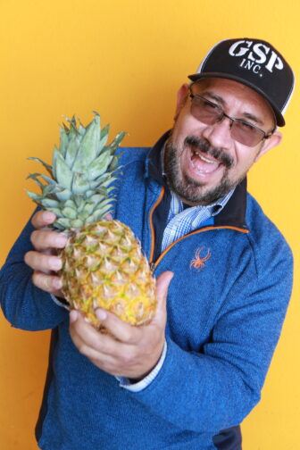 Lupe holding pineapple