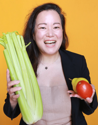 Nancy holding fruit and vegetables