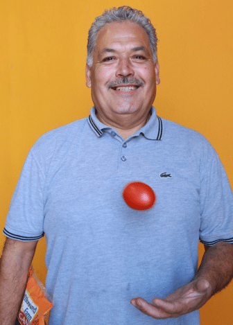 Victor tossing tomato in air
