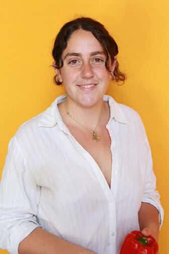 Ayden in front of orange background